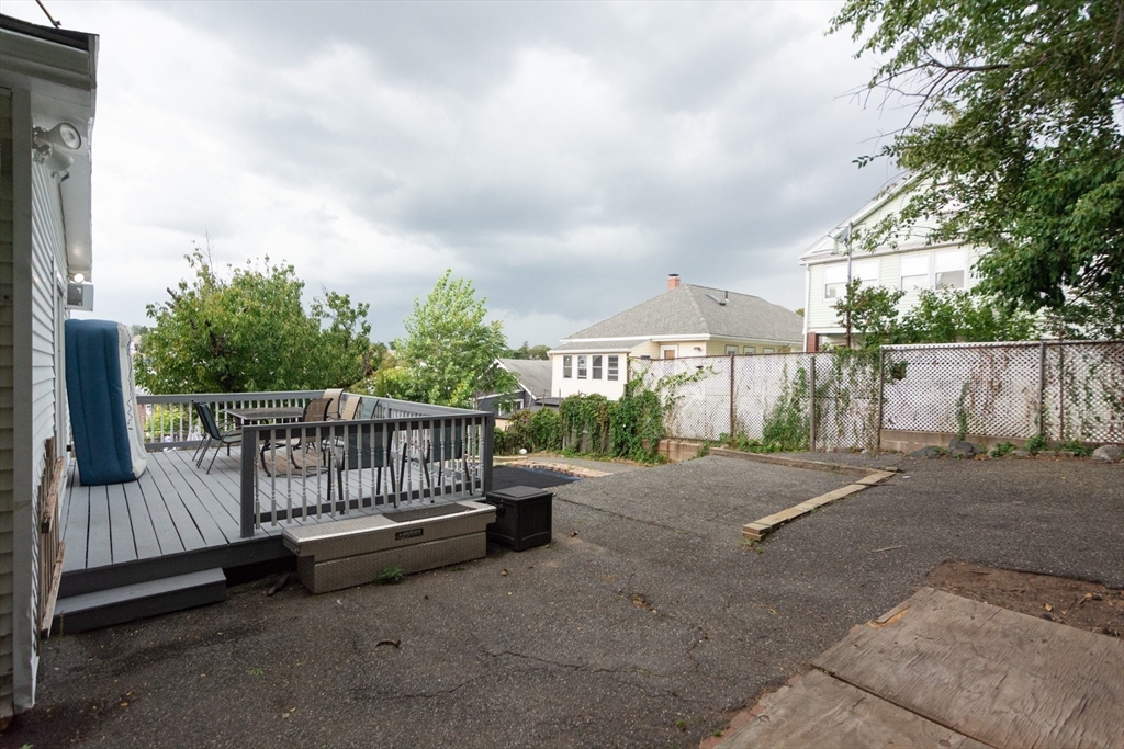 14 Russell Street Everett, MA 02149 - Photo 32 of 32 a view of a backyard with wooden fence