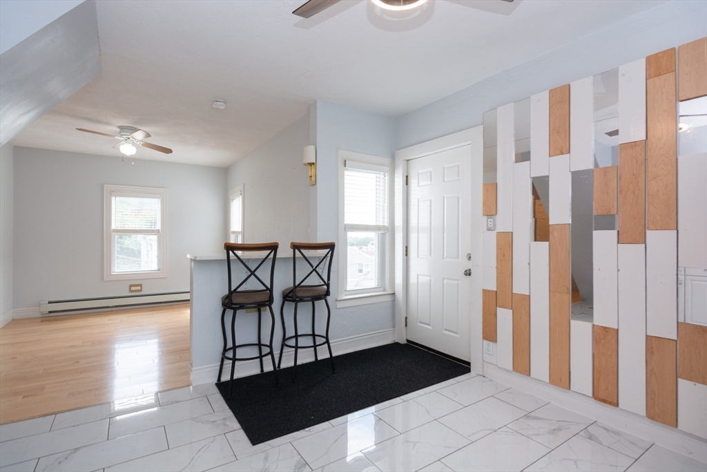 14 Russell Street Everett, MA 02149 - Photo 10 of 32 a view of a hallway with furniture and front door