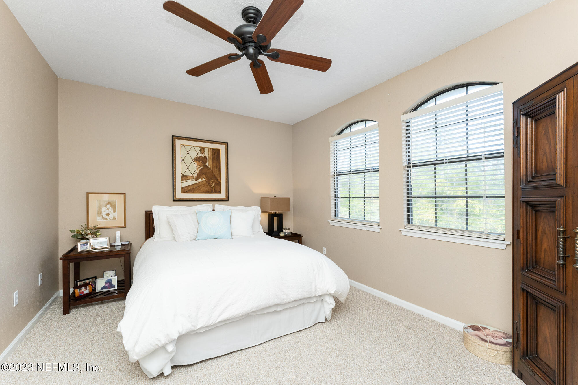 1321 Vista Cove Road St. Augustine, FL 32084 - Photo 13 of 27 a bedroom with a large bed and a large window
