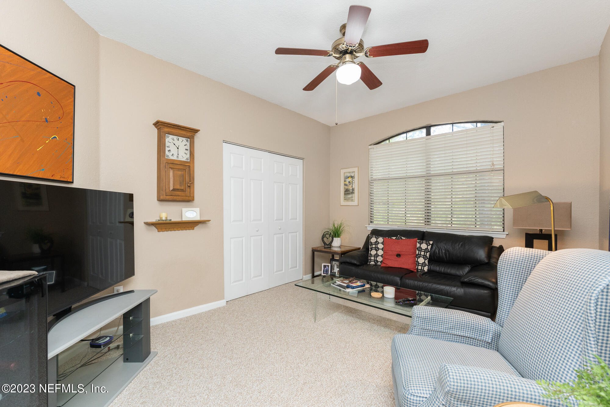 1321 Vista Cove Road St. Augustine, FL 32084 - Photo 16 of 27 a living room with furniture and a flat screen tv