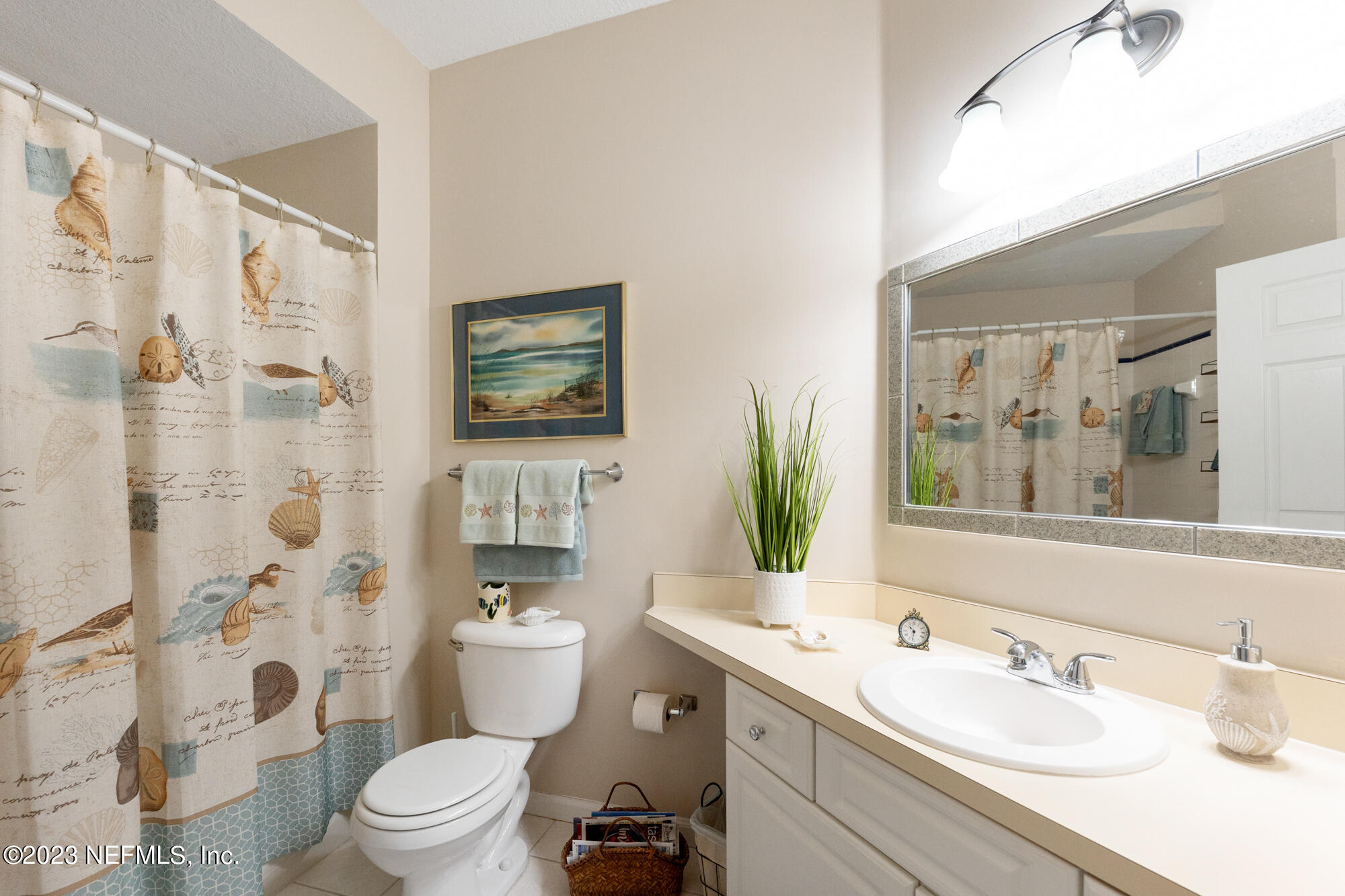 1321 Vista Cove Road St. Augustine, FL 32084 - Photo 17 of 27 a bathroom with a sink toilet a mirror a vanity and shower