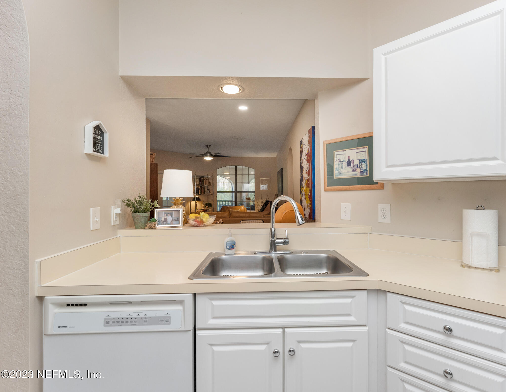 1321 Vista Cove Road St. Augustine, FL 32084 - Photo 5 of 27 a view with granite countertop a sink and cabinets