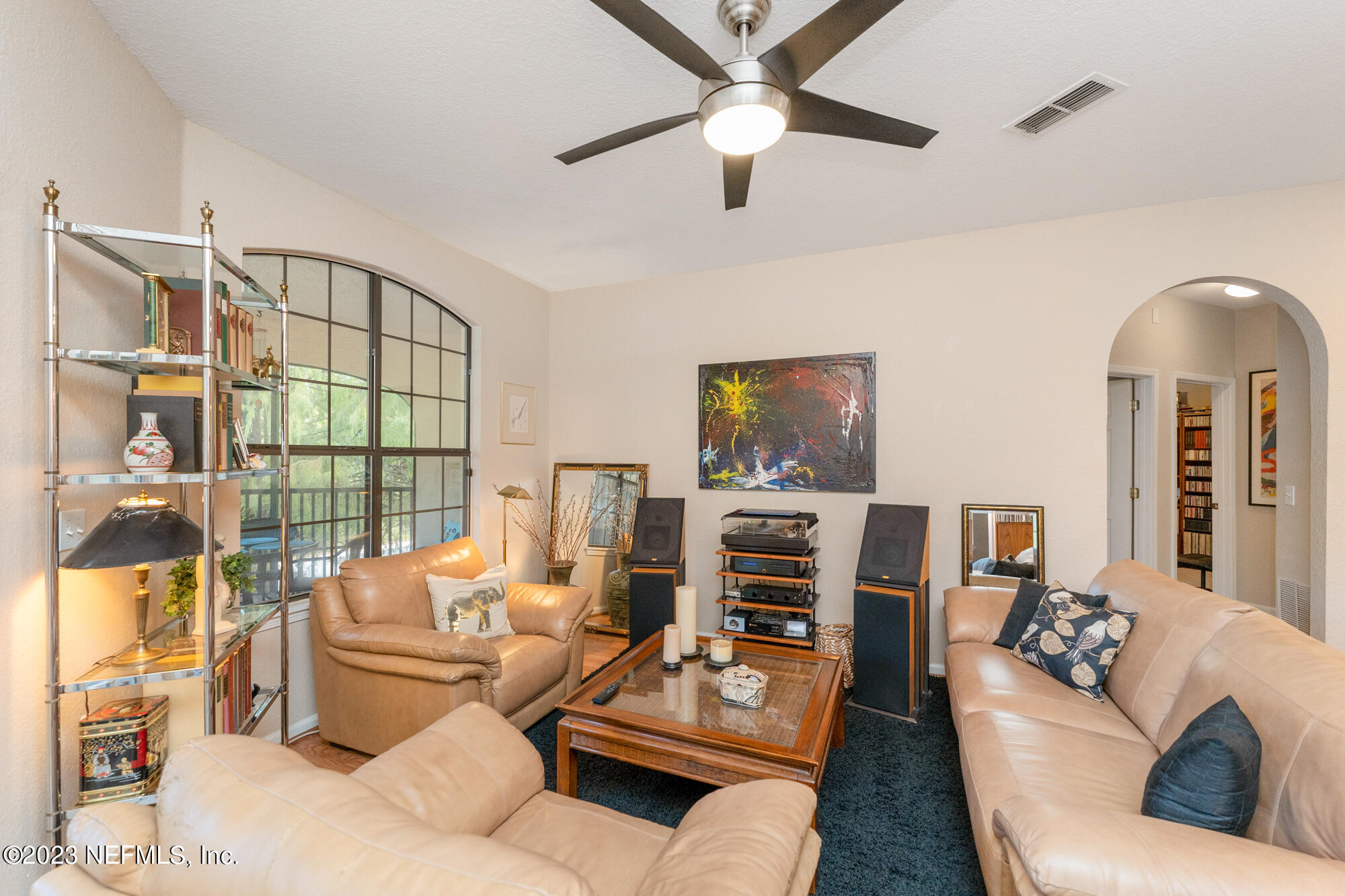 1321 Vista Cove Road St. Augustine, FL 32084 - Photo 8 of 27 a living room with furniture and a flat screen tv