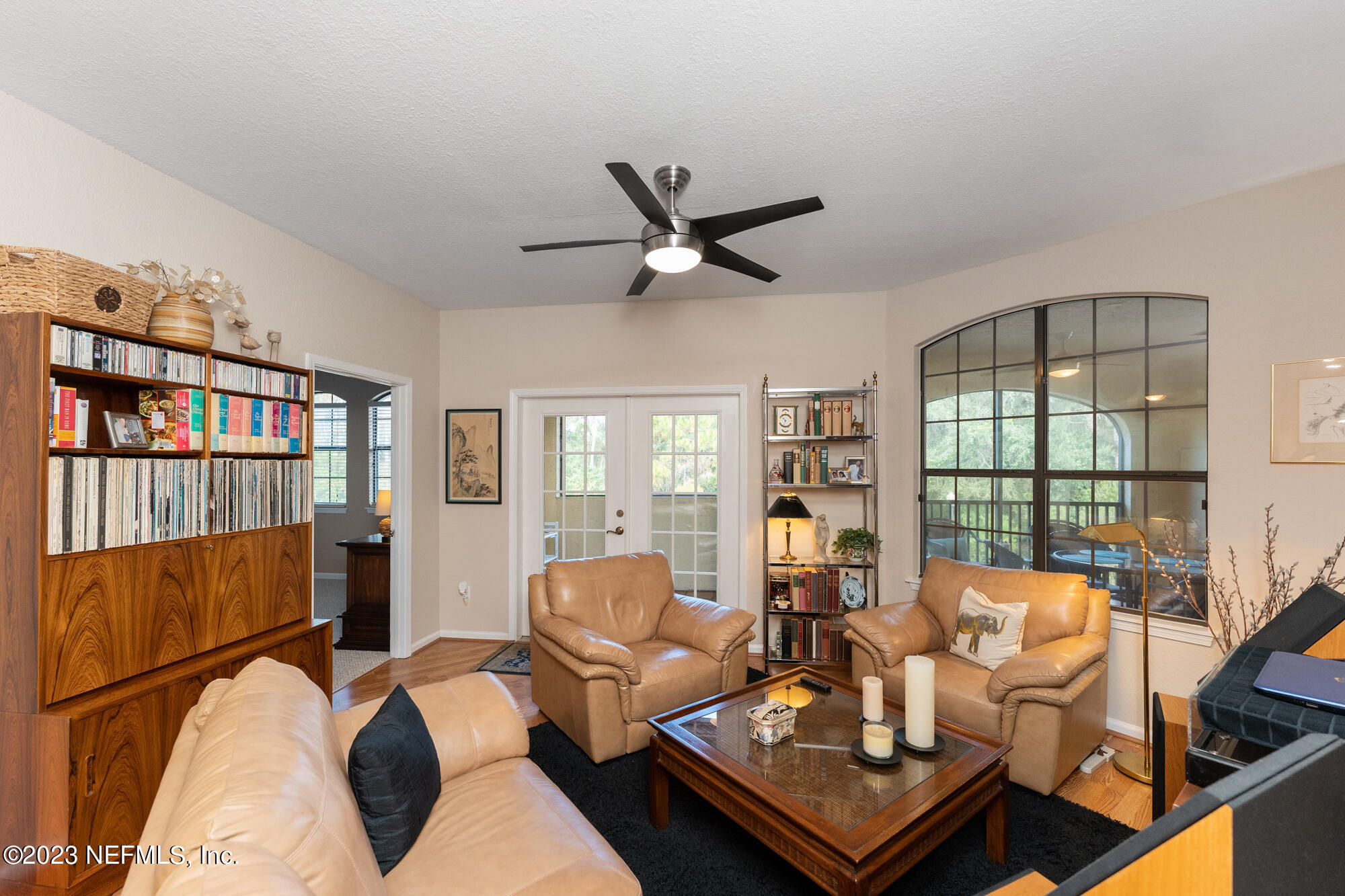 1321 Vista Cove Road St. Augustine, FL 32084 - Photo 9 of 27 a living room with furniture large window and wooden floor