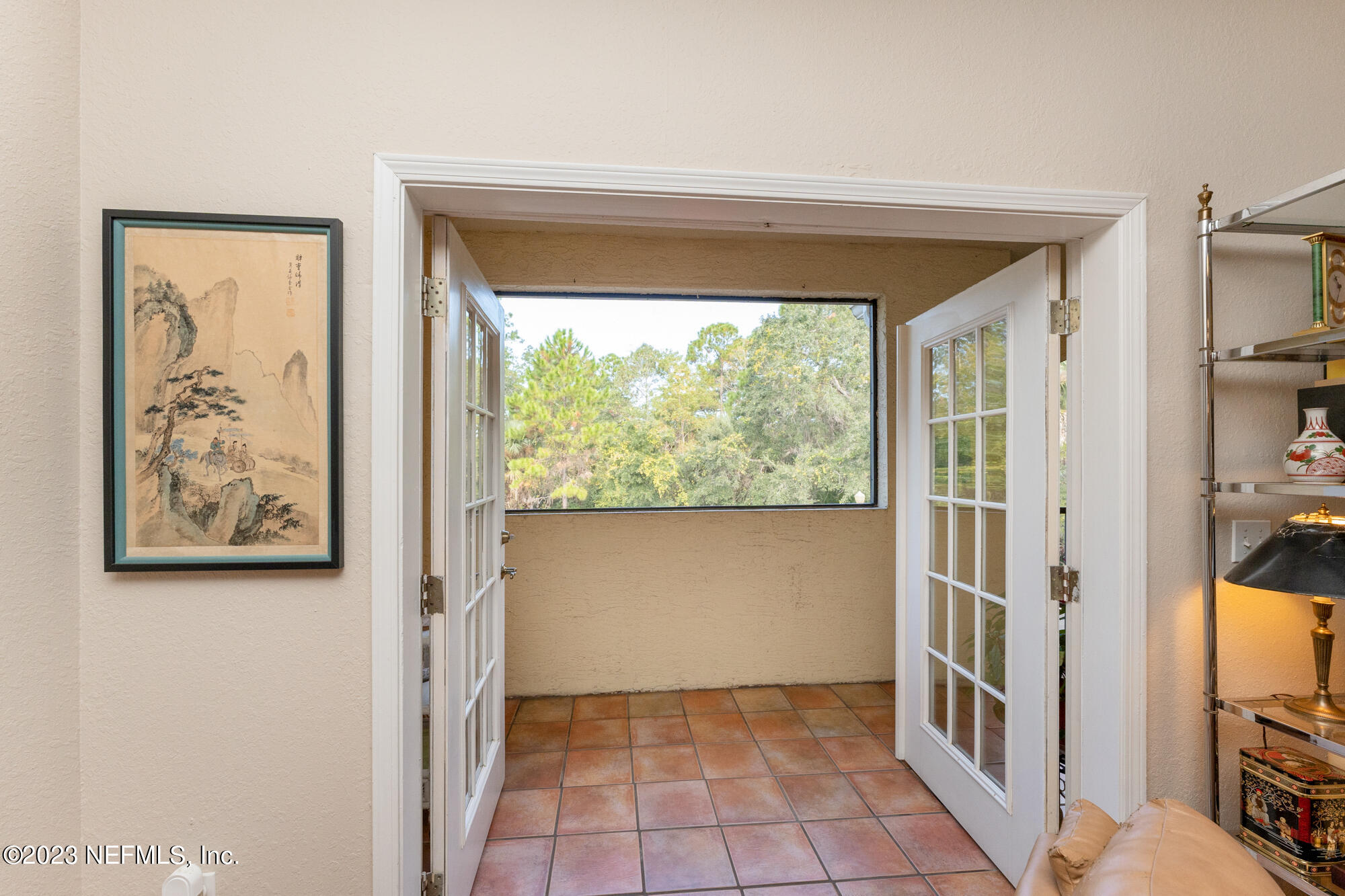1321 Vista Cove Road St. Augustine, FL 32084 - Photo 10 of 27 a view of a hallway with wooden floor and a bathroom