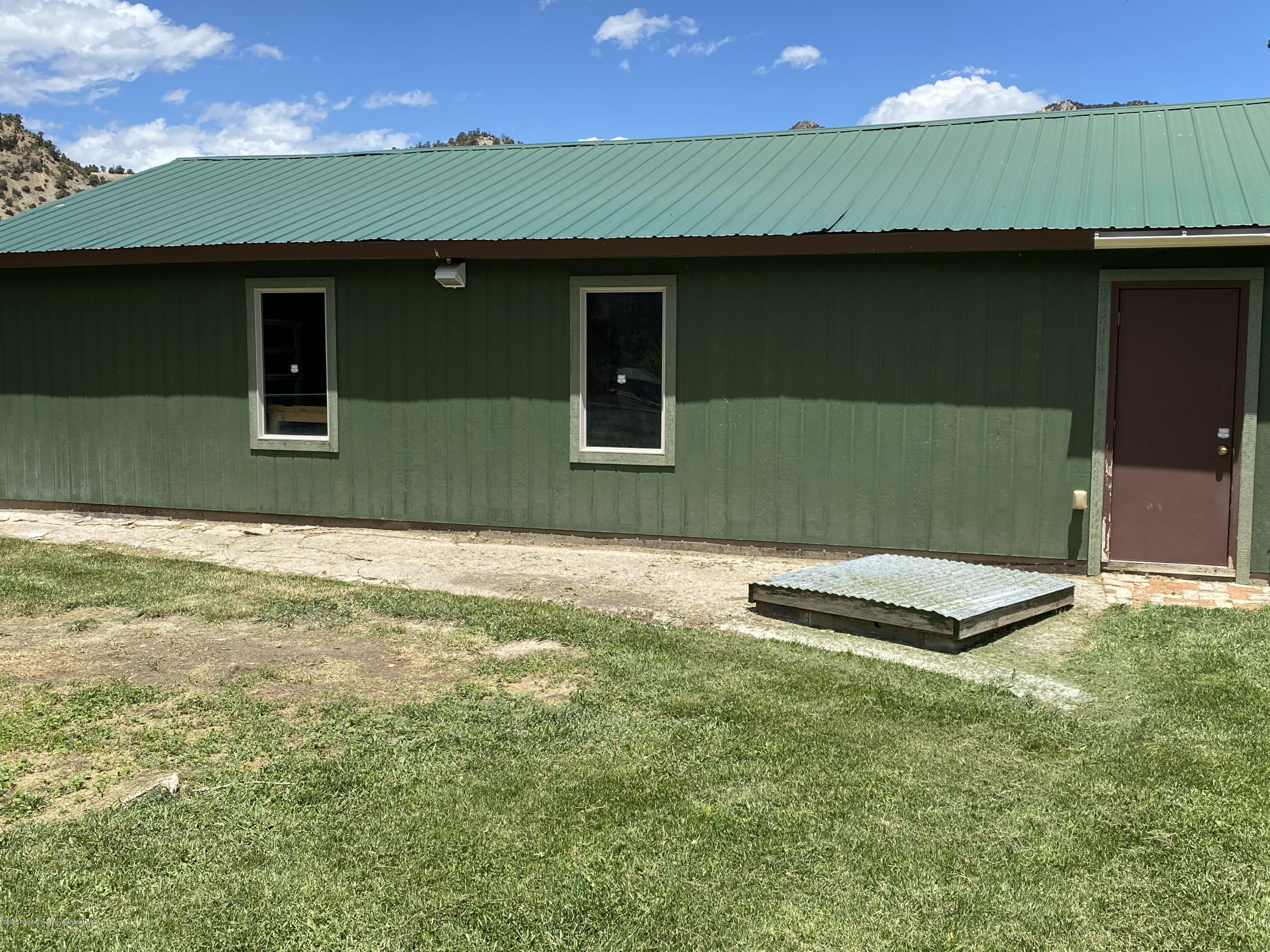 133 County Road 263 Silt, CO 81652 - Photo 12 of 16 a front view of a house with a yard