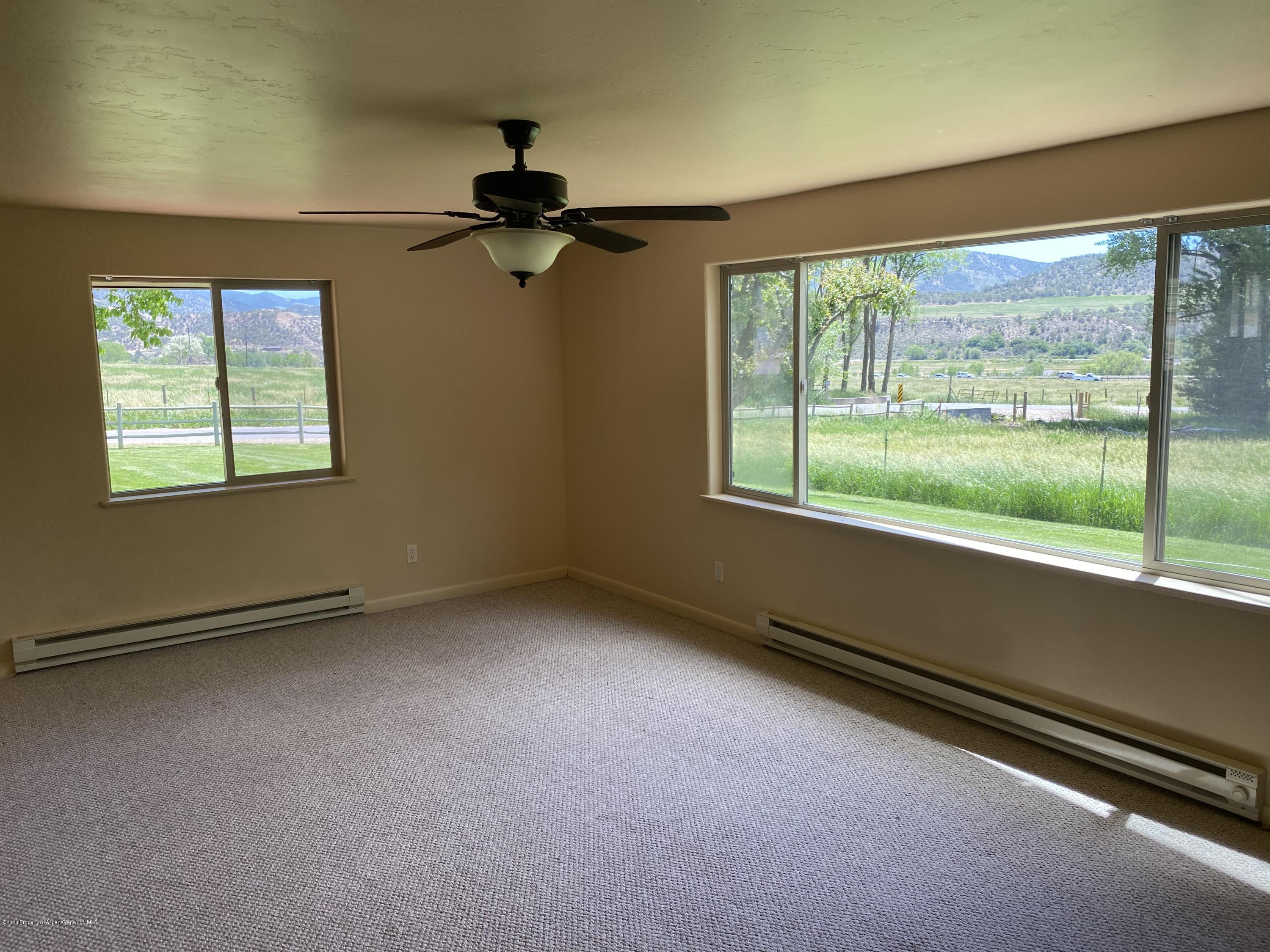 133 County Road 263 Silt, CO 81652 - Photo 8 of 16 an empty room with a window