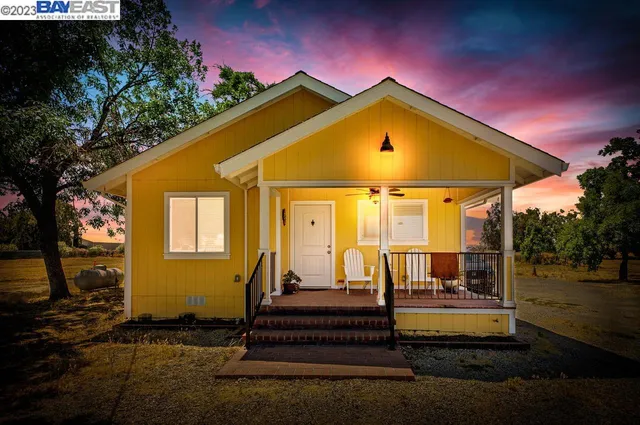 a view of a backyard with a lake view