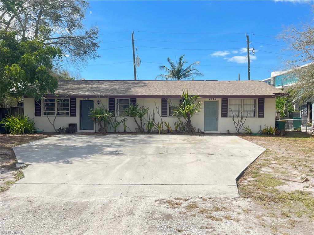 4775 West Alhambra Circle Naples, FL 34103 - Photo 1 of 1 a front view of a house with garden