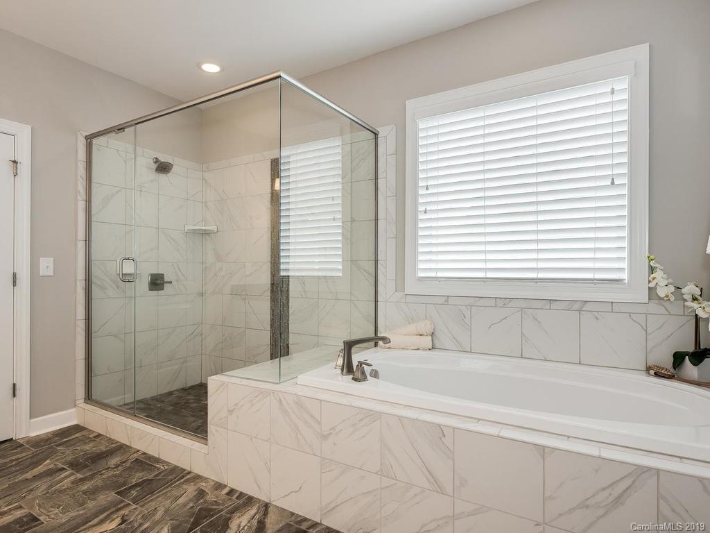 5390 Meadowcroft Way Fort Mill, SC 29708 - Photo 16 of 33 a bathroom with a bathtub and shower