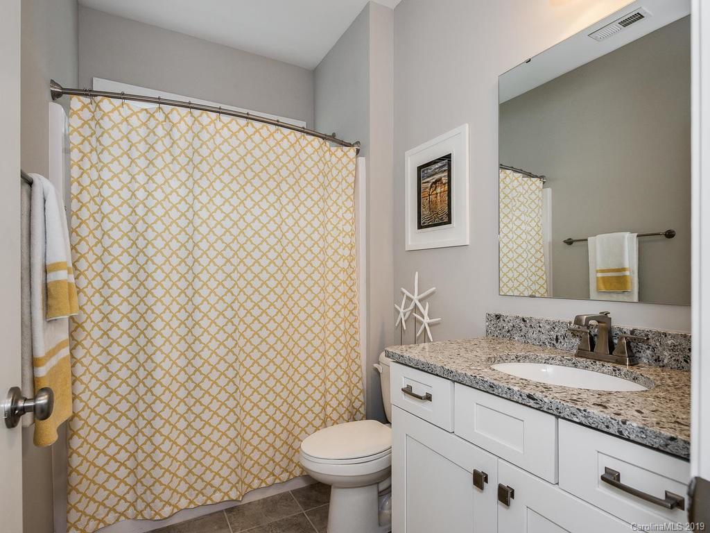 5390 Meadowcroft Way Fort Mill, SC 29708 - Photo 20 of 33 a bathroom with a granite countertop sink and a toilet