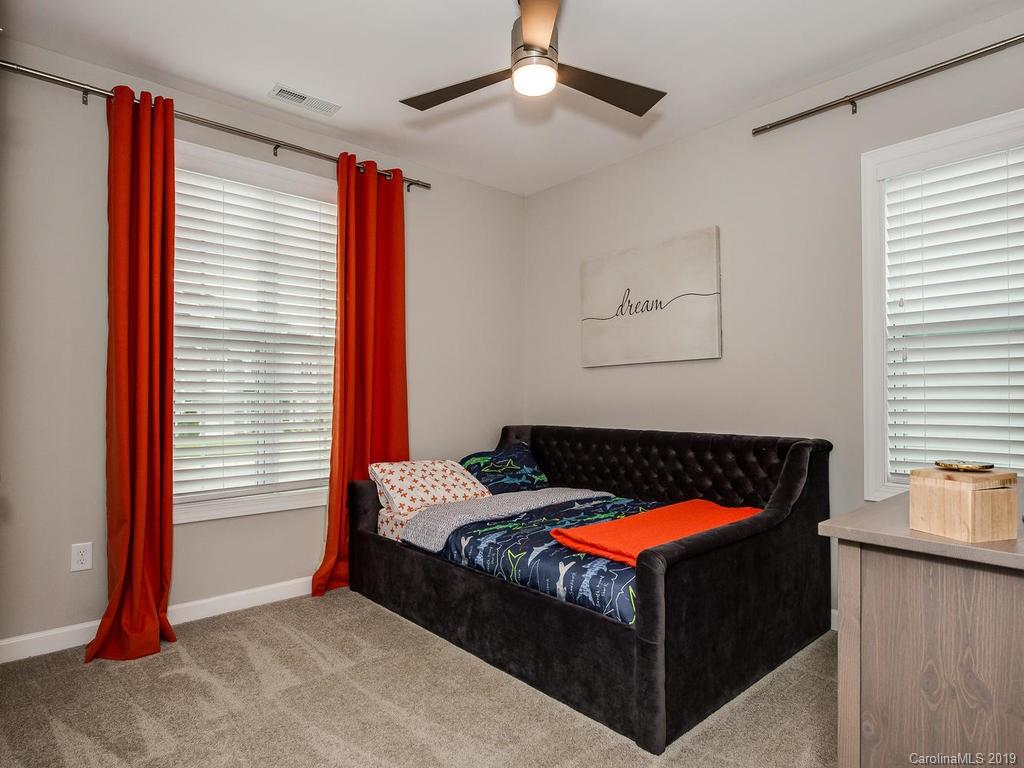 5390 Meadowcroft Way Fort Mill, SC 29708 - Photo 24 of 33 a bed sitting in a bedroom next to a window
