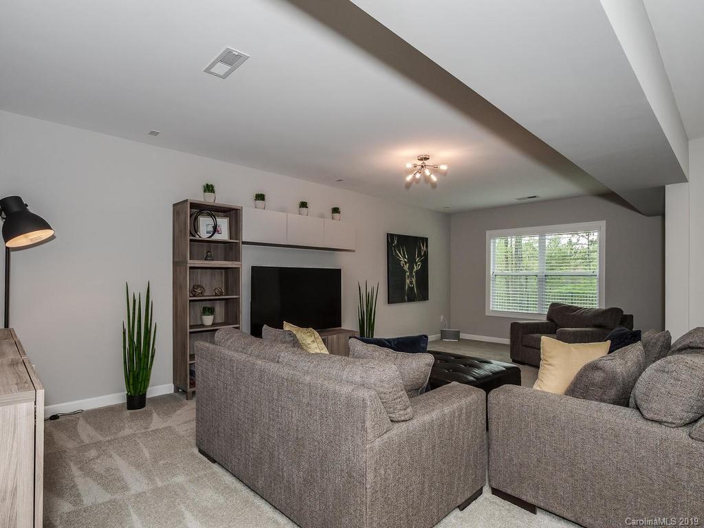 5390 Meadowcroft Way Fort Mill, SC 29708 - Photo 27 of 33 a living room with furniture and a flat screen tv