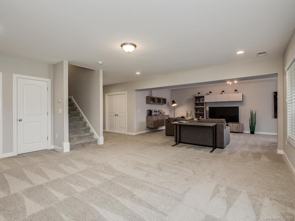 5390 Meadowcroft Way Fort Mill, SC 29708 - Photo 29 of 33 a living room with furniture and a wooden floor