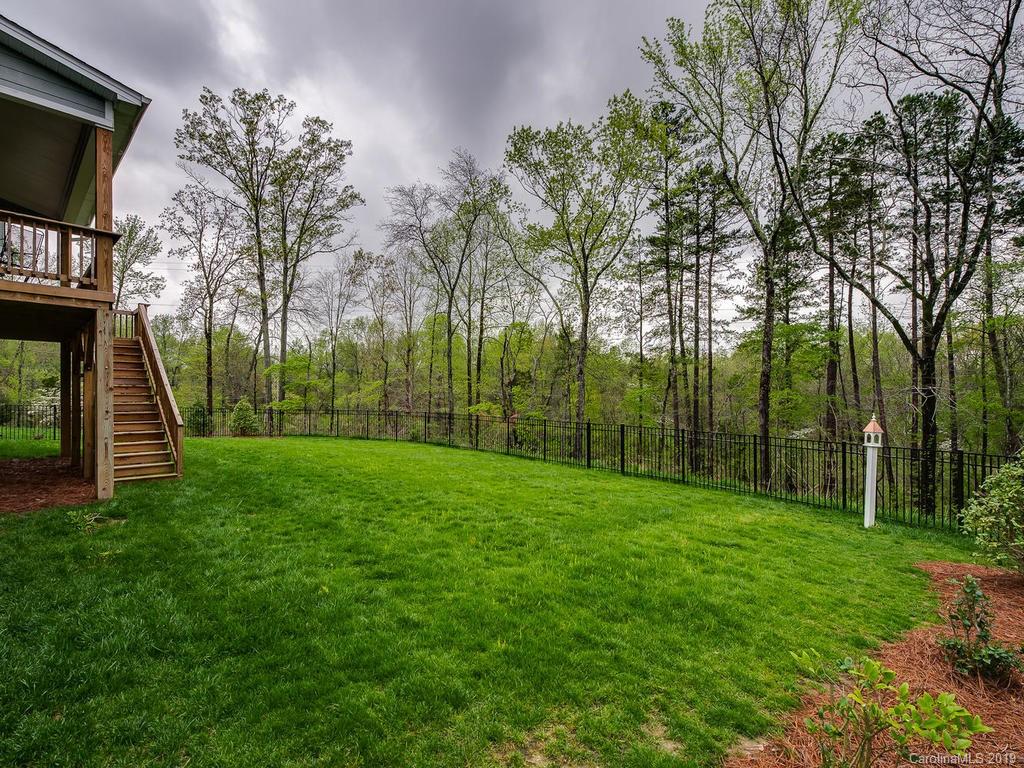 5390 Meadowcroft Way Fort Mill, SC 29708 - Photo 32 of 33 a view of a backyard with large trees