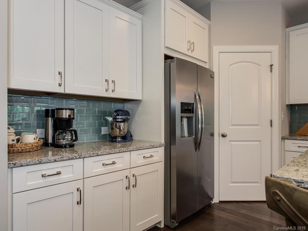 5390 Meadowcroft Way Fort Mill, SC 29708 - Photo 8 of 33 a kitchen with stainless steel appliances granite countertop a refrigerator and white cabinets