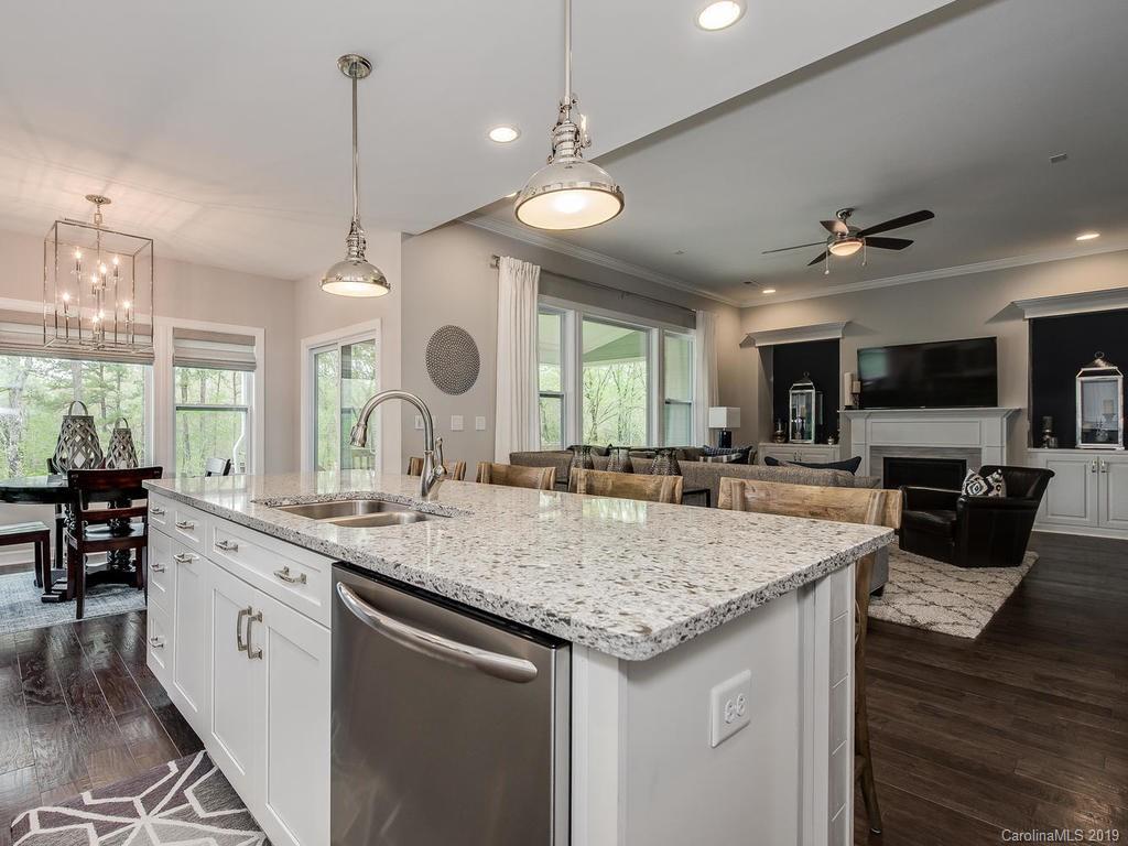 5390 Meadowcroft Way Fort Mill, SC 29708 - Photo 9 of 33 a large kitchen with granite countertop a large island in the center