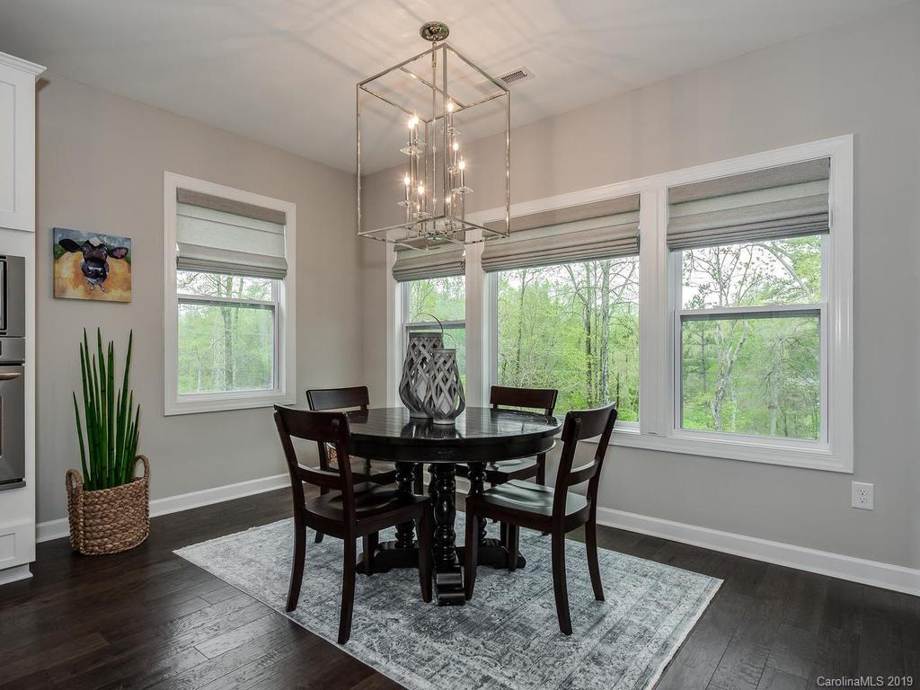 5390 Meadowcroft Way Fort Mill, SC 29708 - Photo 10 of 33 a view of a dining room with furniture window and wooden floor