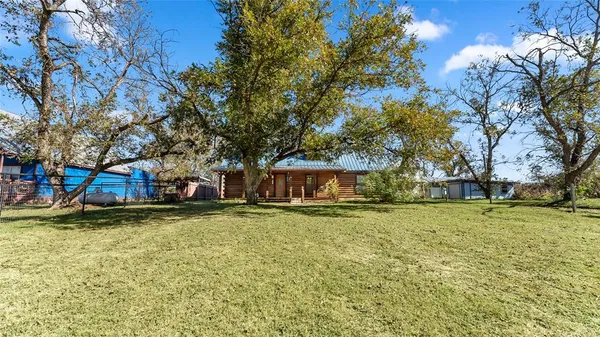 front view of a house with a tree