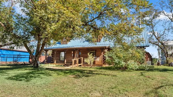 a view of a backyard with a large tree