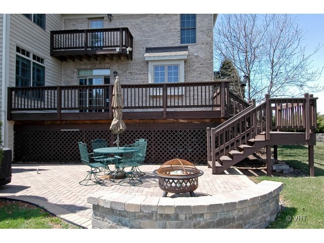 3-n943 Ralph Waldo Emerson Lane St. Charles, IL 60175 - Photo 15 of 24 a view of a house with a wooden deck
