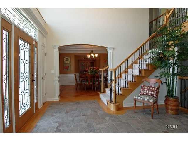 3-n943 Ralph Waldo Emerson Lane St. Charles, IL 60175 - Photo 2 of 24 a view of entryway and hall with wooden floor
