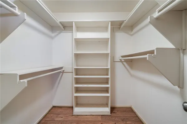 a bathroom with a sink a large mirror and a shower