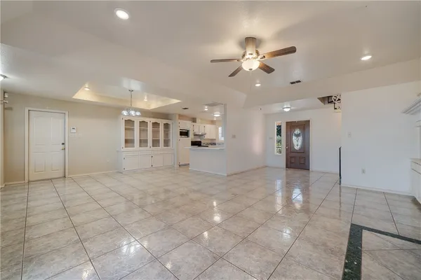 a view of an empty room with a fireplace