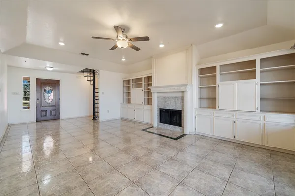 a view of a kitchen with a sink and a refrigerator