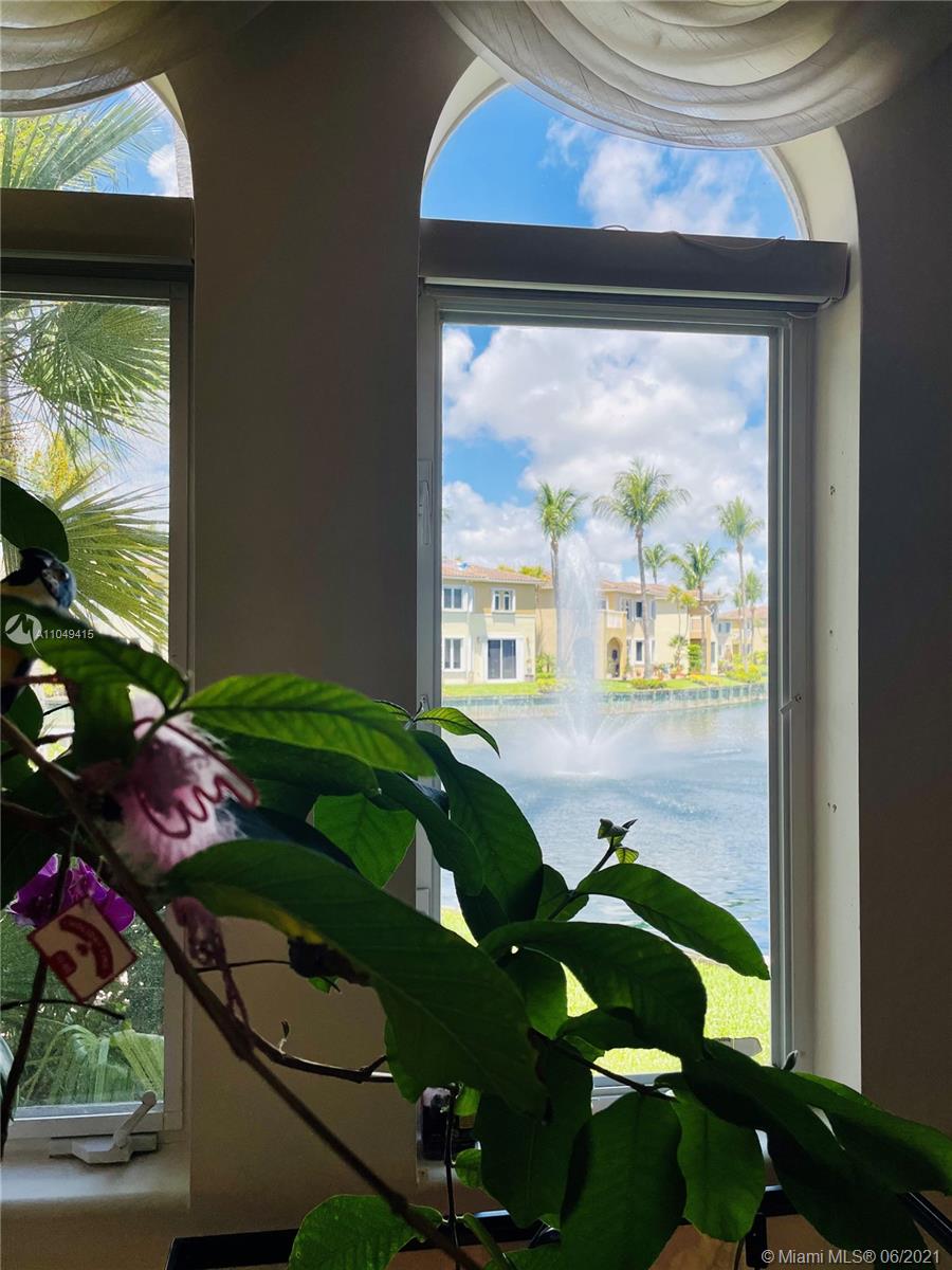 Aventura Aventura, FL 33180 - Photo 15 of 37 a room with painting on the wall and a large window