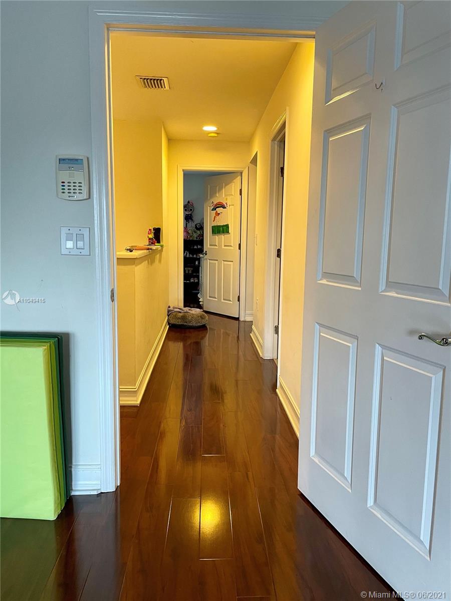 Aventura Aventura, FL 33180 - Photo 20 of 37 a view of a hallway with wooden floor