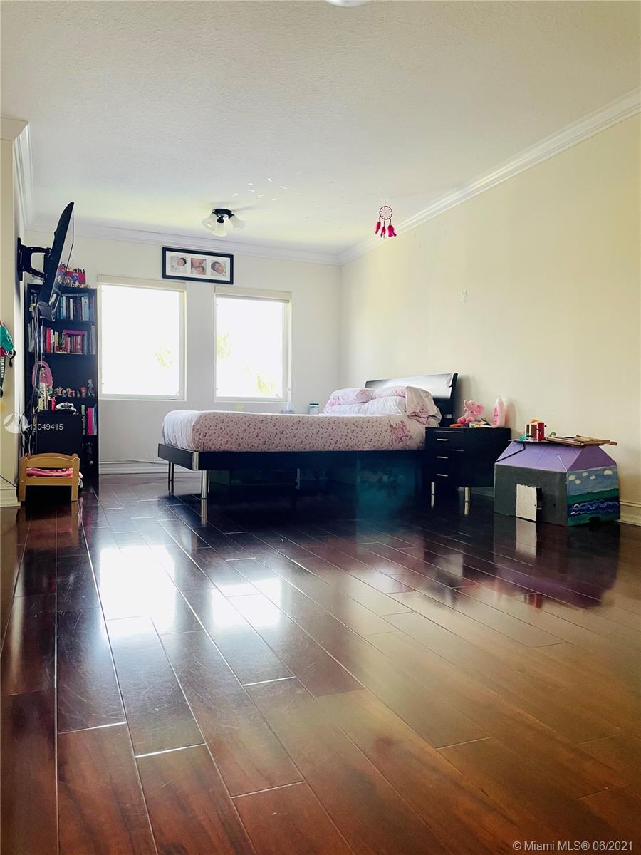 Aventura Aventura, FL 33180 - Photo 21 of 37 a living room with furniture and a book shelf