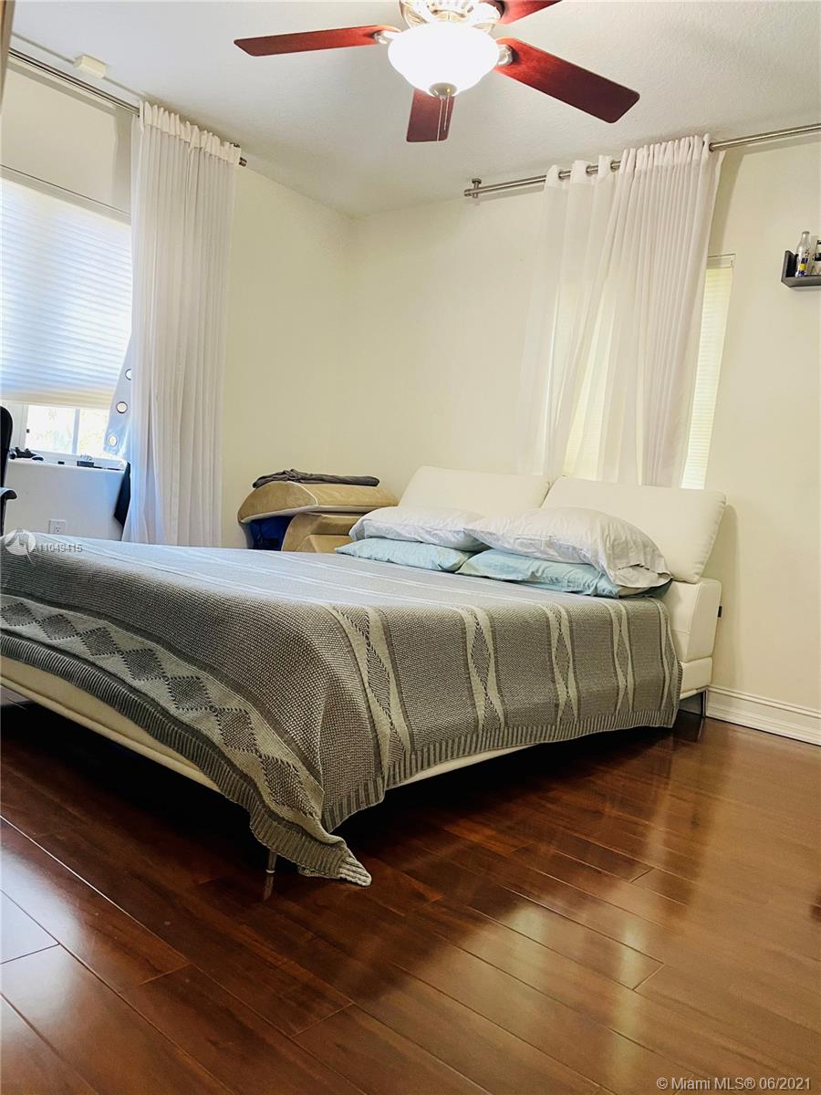 Aventura Aventura, FL 33180 - Photo 28 of 37 a bedroom with a bed and a mirror