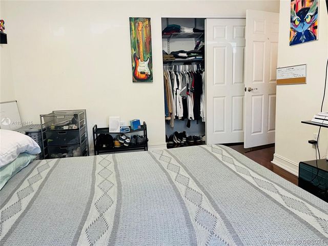 a bathroom with a sink a mirror and a shower