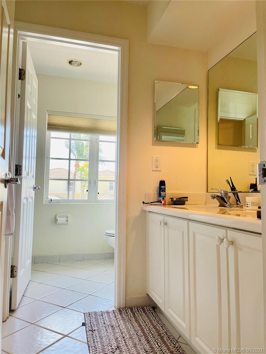 Aventura Aventura, FL 33180 - Photo 30 of 37 a bathroom with a sink a mirror and a shower