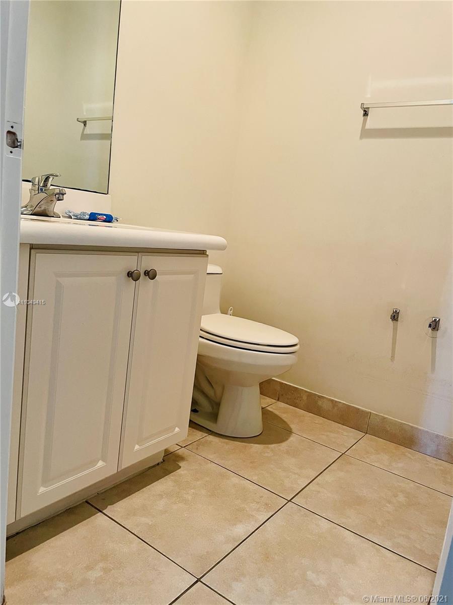 Aventura Aventura, FL 33180 - Photo 35 of 37 a bathroom with a sink and a toilet