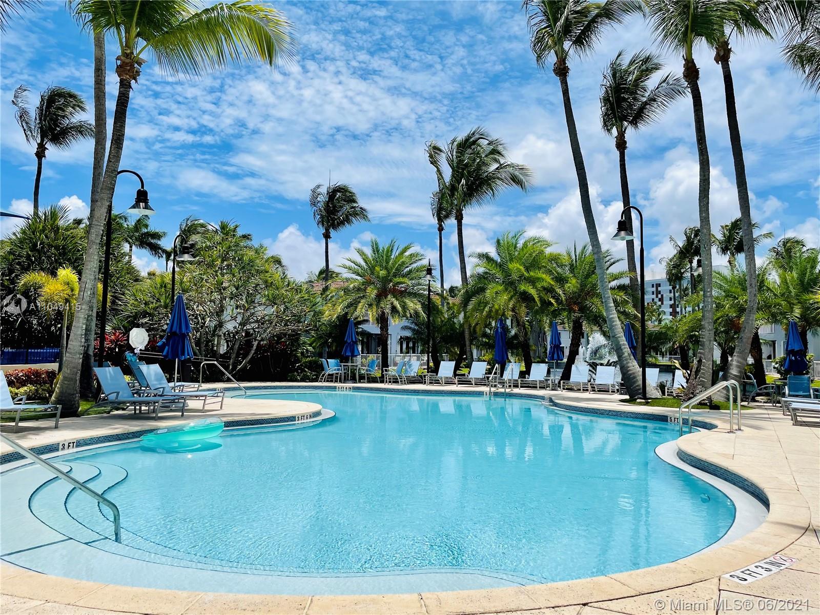 Aventura Aventura, FL 33180 - Photo 37 of 37 a view of swimming pool with a lawn chairs and palm tree