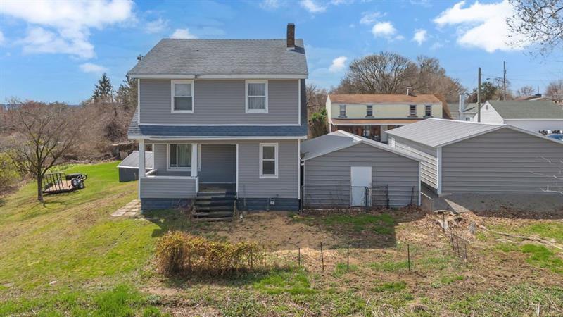 3159 Brodhead Road Aliquippa, PA 15001 - Photo 2 of 30 a front view of a house with a yard