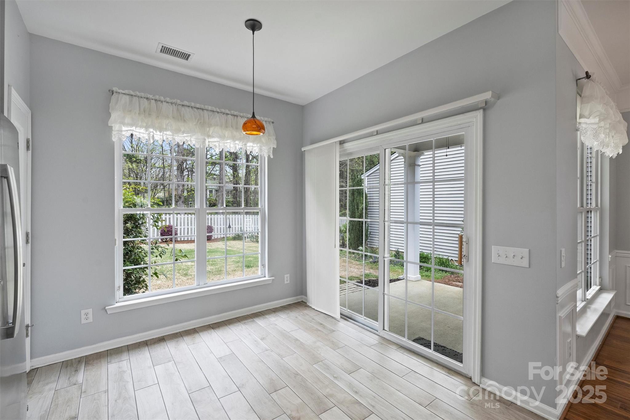 11422 Nevermore Way Charlotte, NC 28277 - Photo 15 of 34 a view of a room with wooden floor and windows