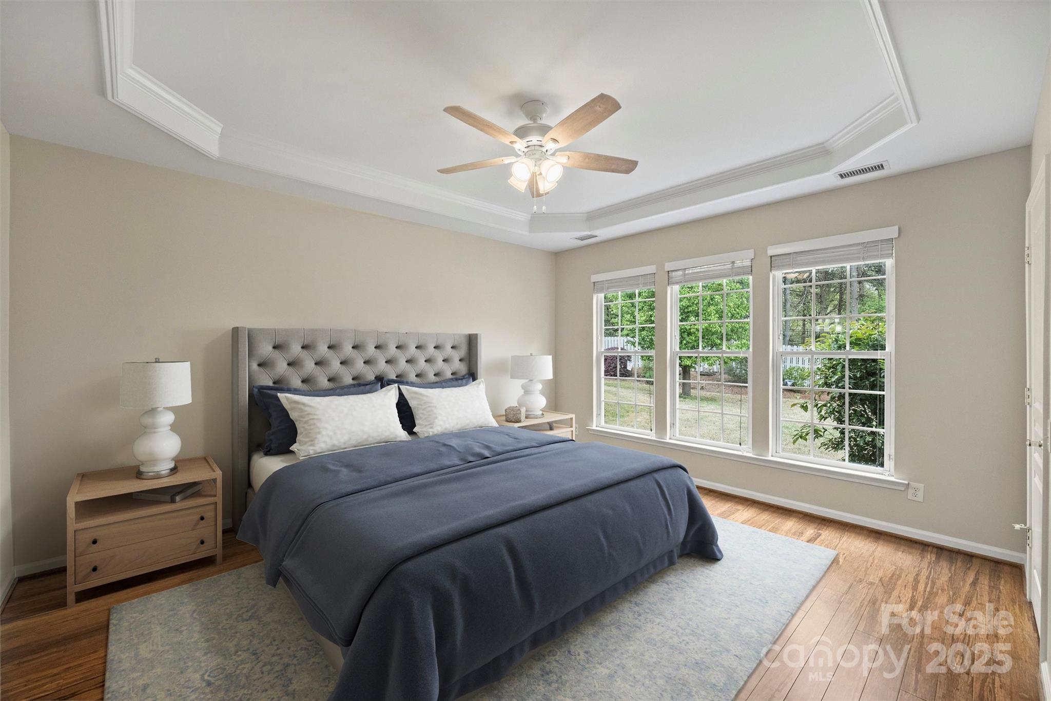 11422 Nevermore Way Charlotte, NC 28277 - Photo 17 of 34 a bedroom with a large bed and a large window