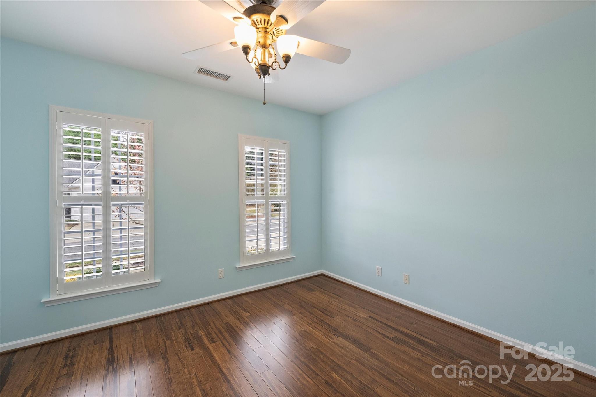 11422 Nevermore Way Charlotte, NC 28277 - Photo 24 of 34 an empty room with wooden floor and window