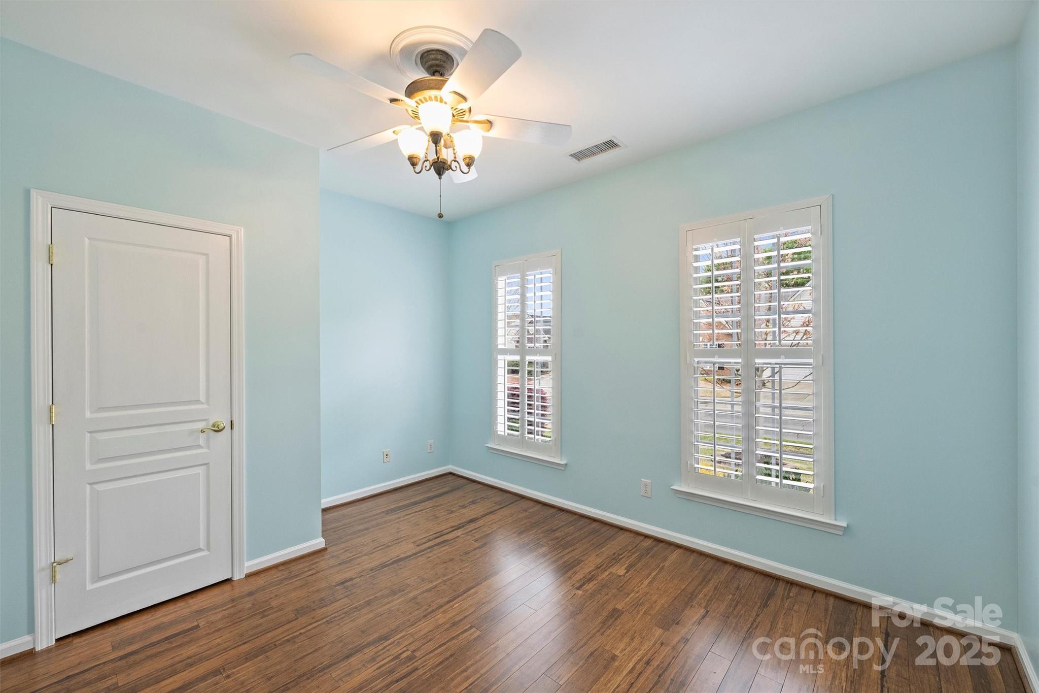11422 Nevermore Way Charlotte, NC 28277 - Photo 25 of 34 a view of an empty room with a window and wooden floor