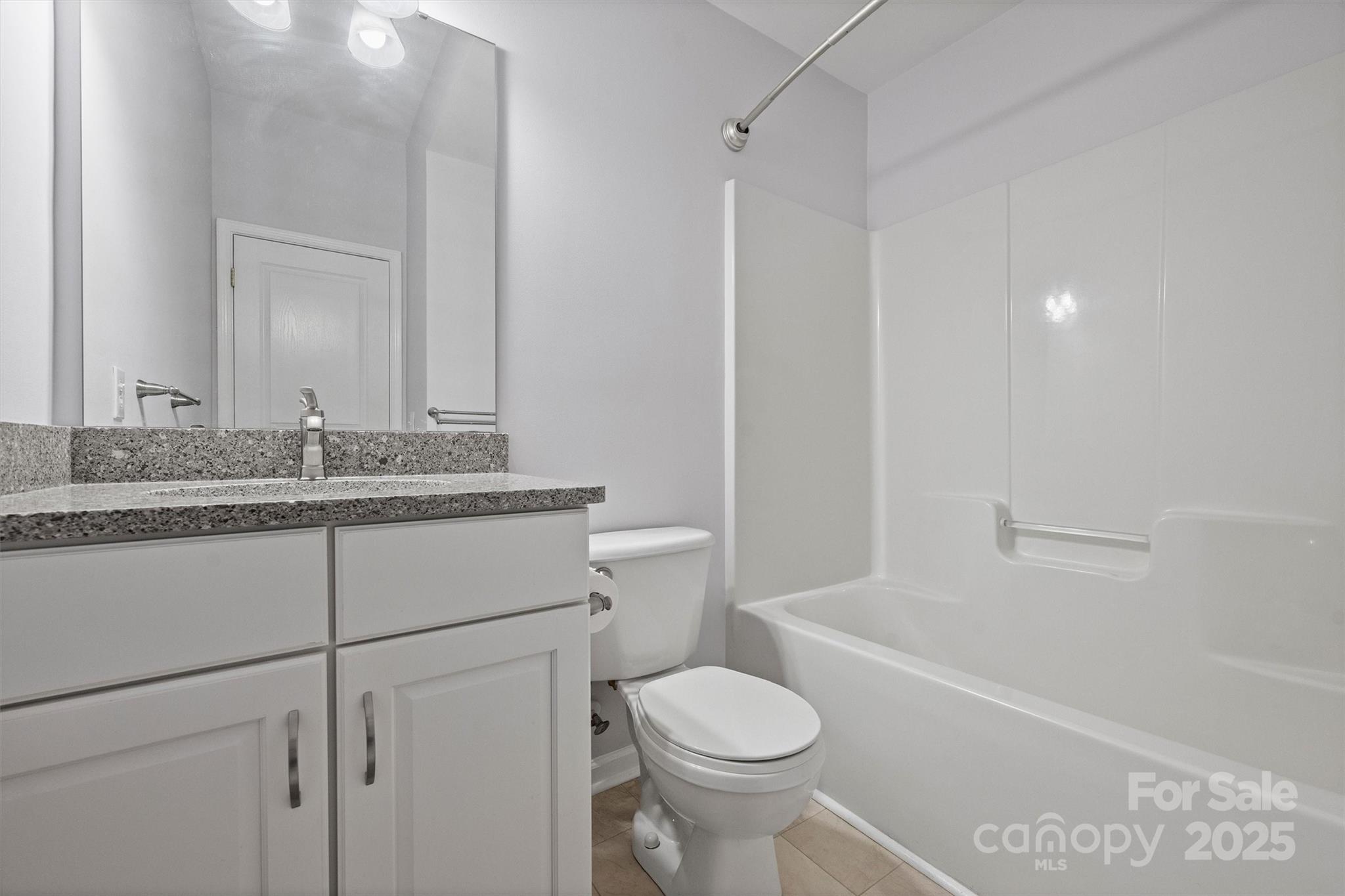 11422 Nevermore Way Charlotte, NC 28277 - Photo 26 of 34 a bathroom with a sink toilet vanity and tub