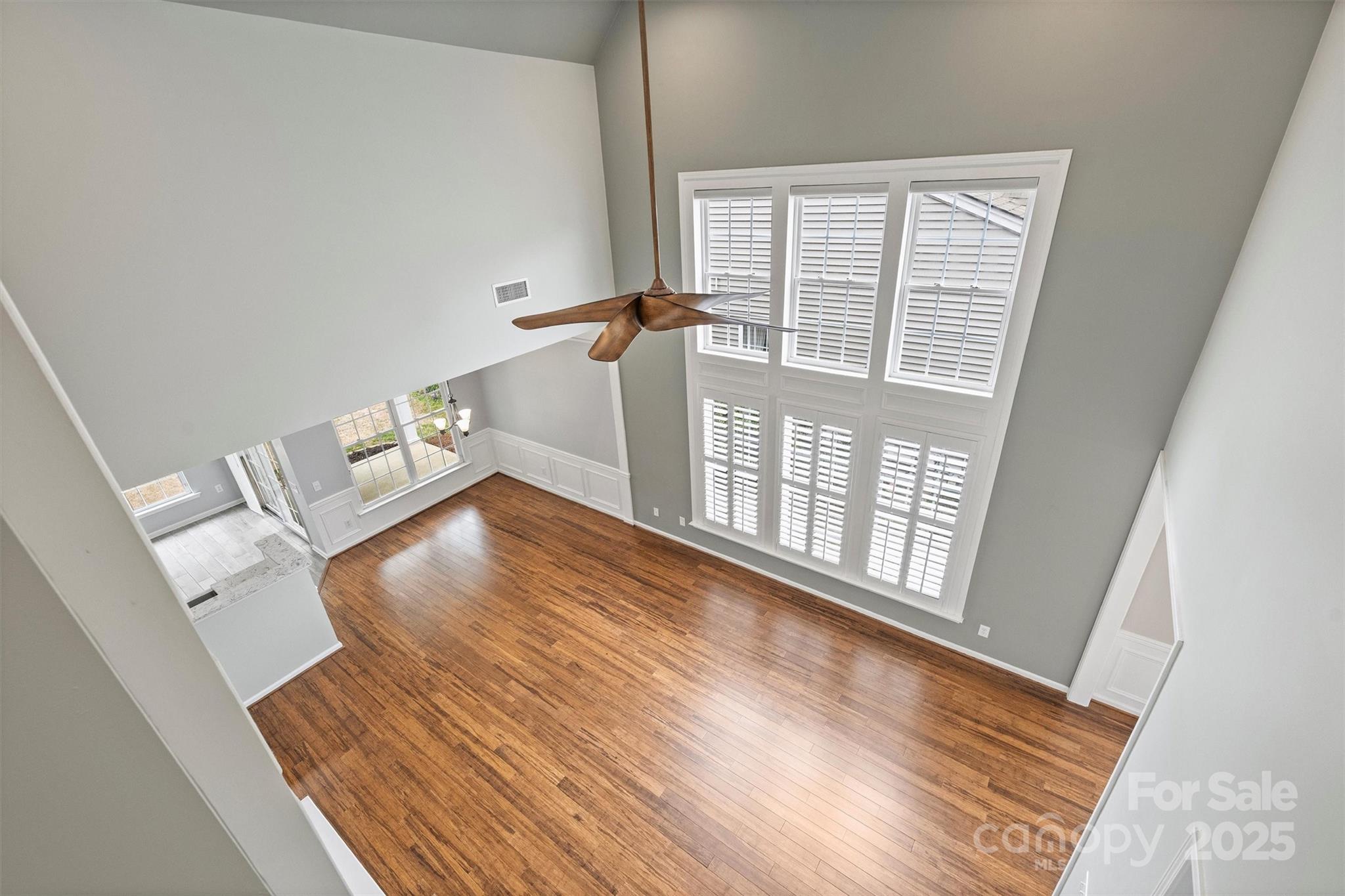 11422 Nevermore Way Charlotte, NC 28277 - Photo 28 of 34 a view of an empty room with wooden floor and a window