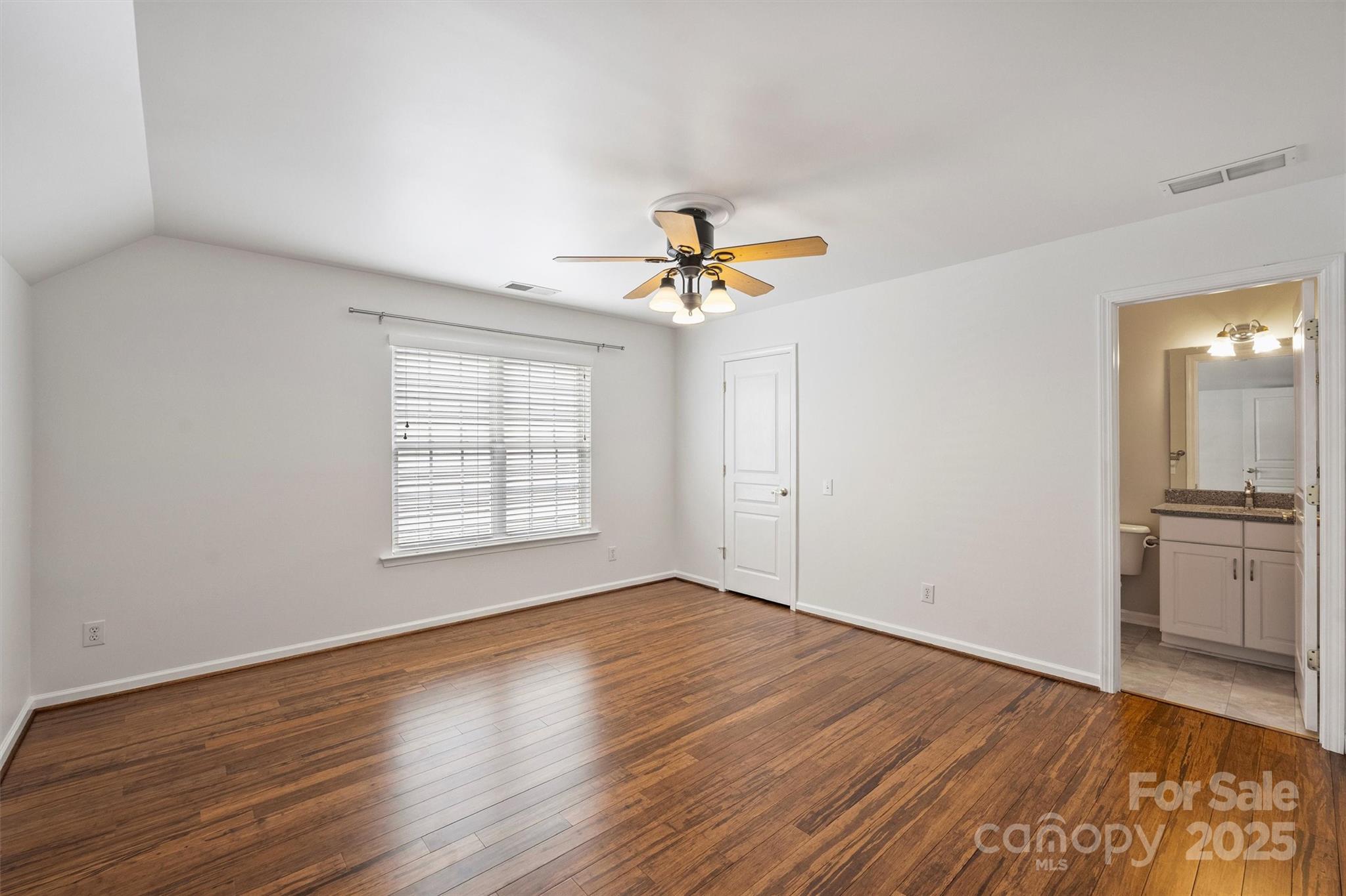 11422 Nevermore Way Charlotte, NC 28277 - Photo 29 of 34 wooden floor in an empty room with a window