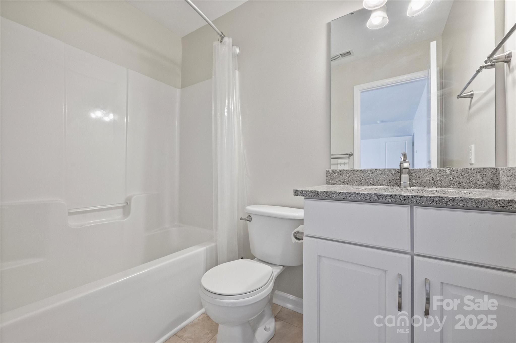 11422 Nevermore Way Charlotte, NC 28277 - Photo 30 of 34 a bathroom with a granite countertop sink toilet and shower