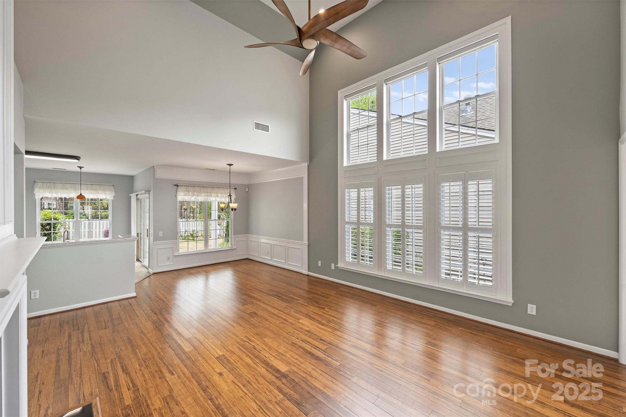 11422 Nevermore Way Charlotte, NC 28277 - Photo 6 of 34 a view of an empty room with wooden floor and a window