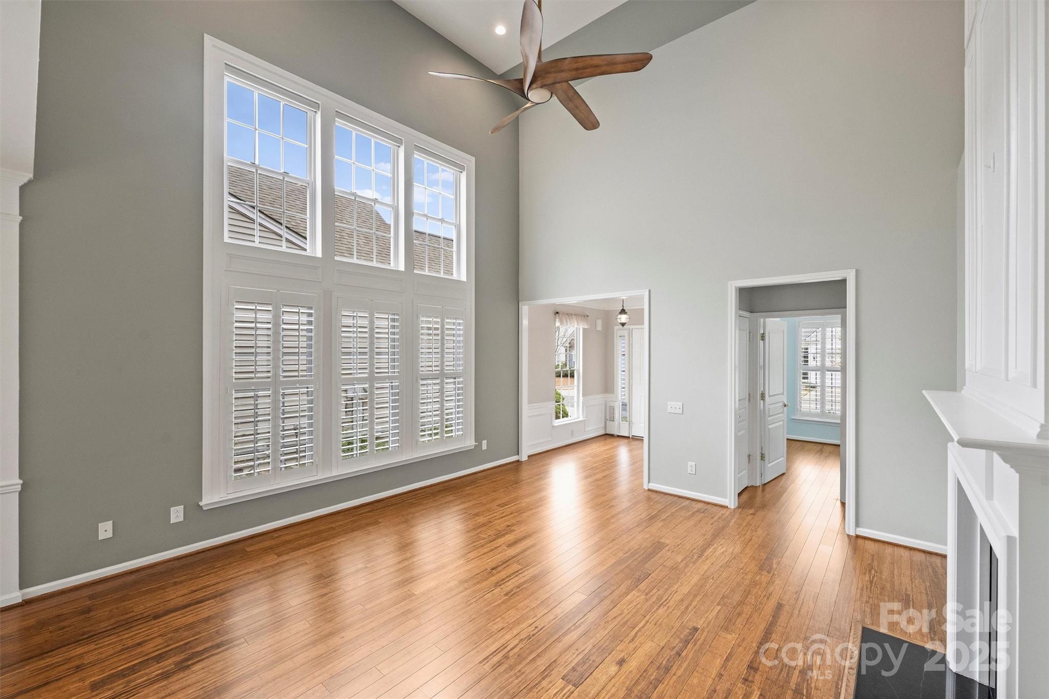 11422 Nevermore Way Charlotte, NC 28277 - Photo 7 of 34 a view of an empty room with wooden floor and a window