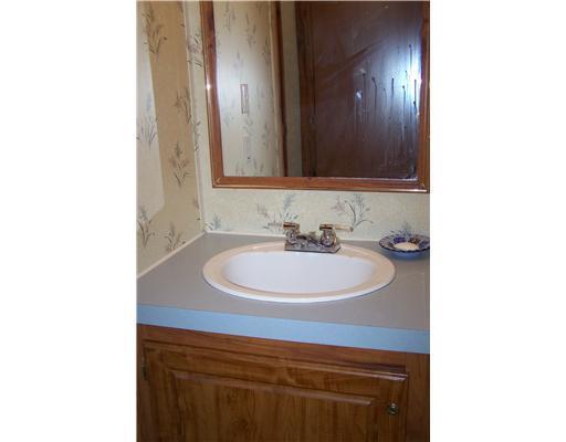 461 Canaan Road Pittsfield, ME 04967 - Photo 17 of 20 Bathroom. Vanity and mirror in...