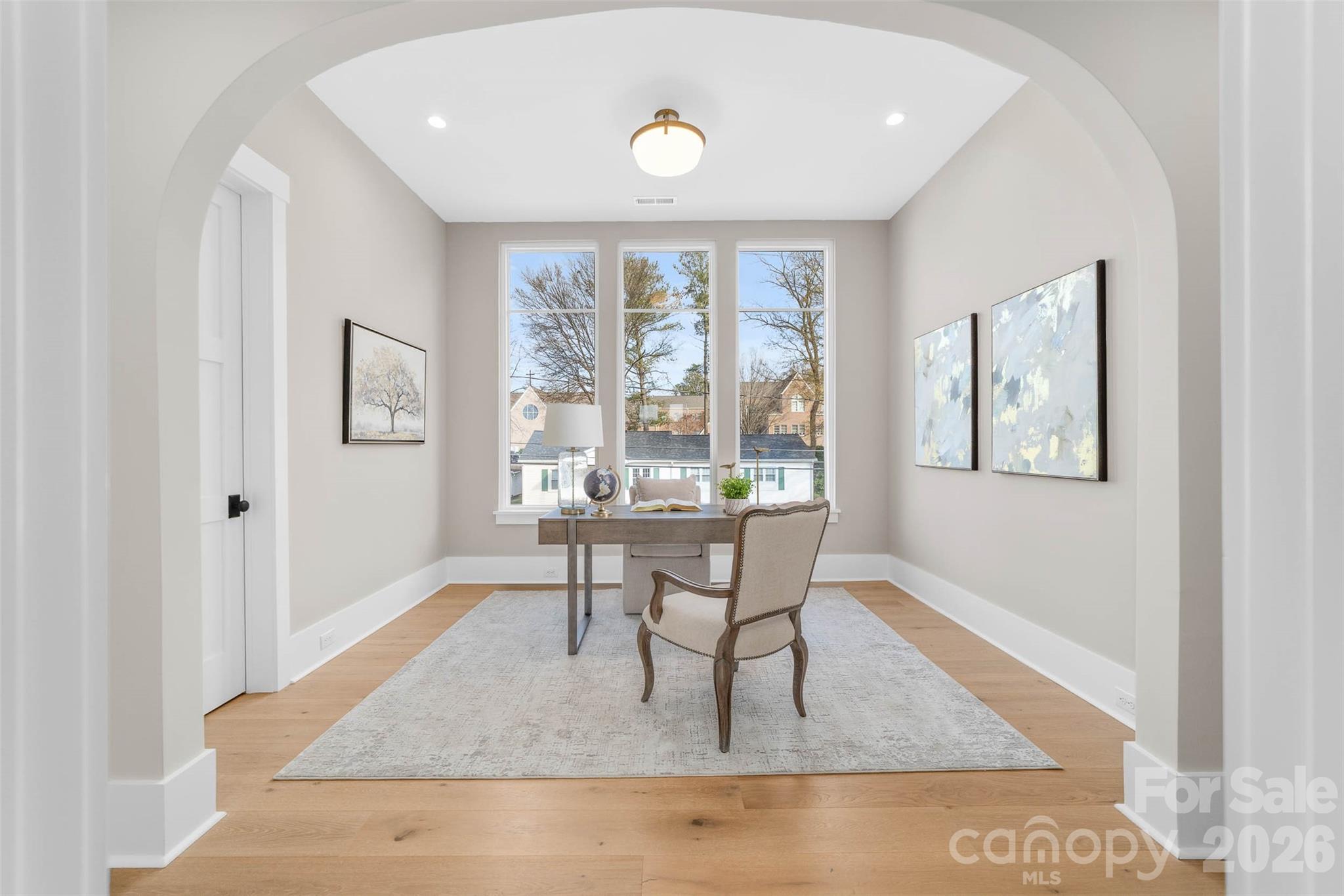 216 Walnut Street Davidson, NC 28036 - Photo 29 of 48 a dining room with wooden floor and a table